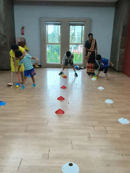 A little indoor hockey action! Using sticks to guide a ball through a course of cones is an excellent activity for developing hand-eye coordination and control. The kids love the challenge!