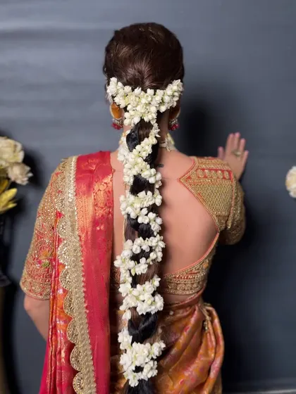 Another angle of the traditional jasmine braid, a classic and beloved choice for South Indian brides.