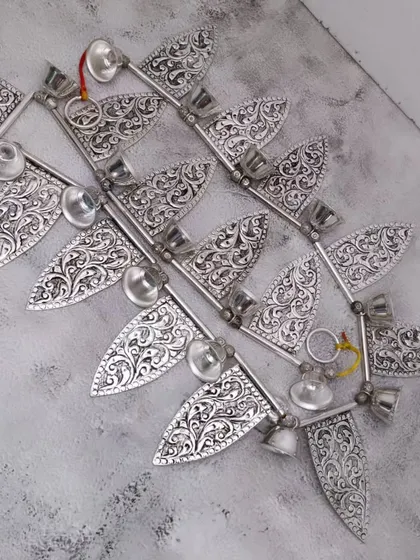 A full view of the antique German silver door toran, a beautiful decorative piece for the entrance of your home or pooja room.