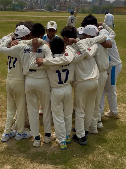 A close-up of the team huddle. Every player is focused and listening.