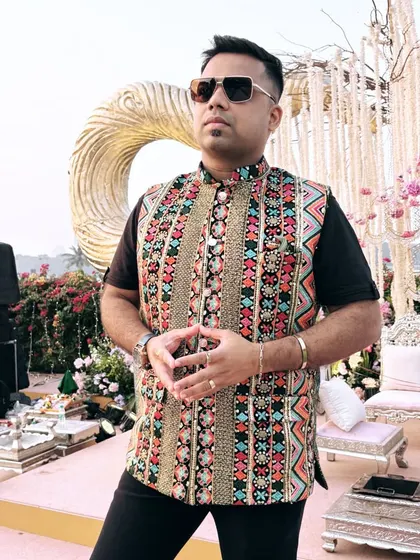 Another angle of my colorful vest. The intricate patterns and vibrant colors reflect the festive spirit of an Indian wedding.