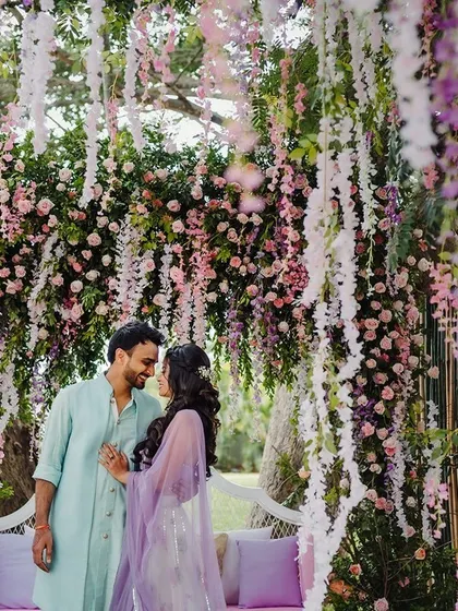A dreamy photo spot under a canopy of hanging wisteria, perfect for romantic couple portraits. I design these details to make your wedding visually stunning.