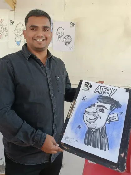 A guest named Ajay with his cool caricature. The blue background makes the drawing pop.
