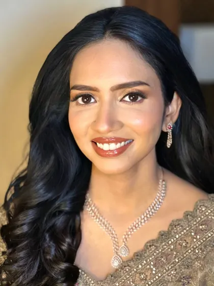 My beautiful reception bride. Her look is all about sophistication, with a warm brown smokey eye, a glossy lip, and a flawless, glowing complexion.