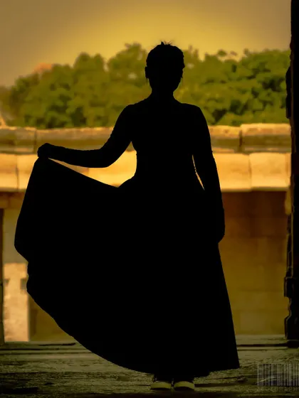 A silhouette against the ancient stones of Hampi. I often incorporate human elements to give a sense of scale and story to my architectural shots.