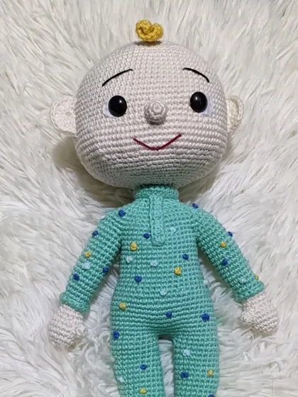 A different version of the JJ doll from Cocomelon, with a slightly different facial expression and details.