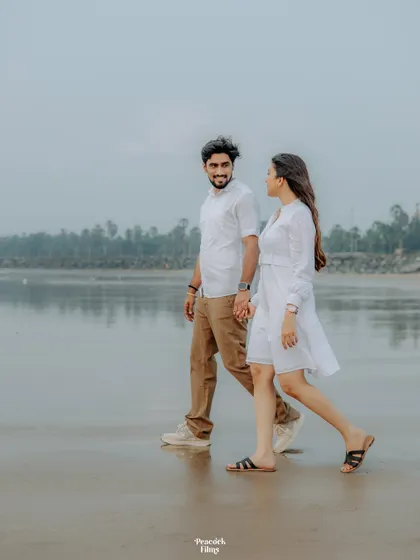 A quiet walk along the shoreline. This pre-wedding photo captures the couple in their own world, the simplicity of the moment highlighting their deep connection.