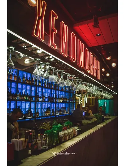 Capturing the electric mood of a bar at night. I use a mix of ambient and artificial light to highlight the key features, from the glowing neon signs to the fully stocked bar, creating an image that invites customers in.