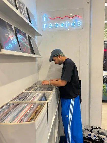 A candid shot of me digging through vinyl at a record store. The search for music is a constant inspiration.