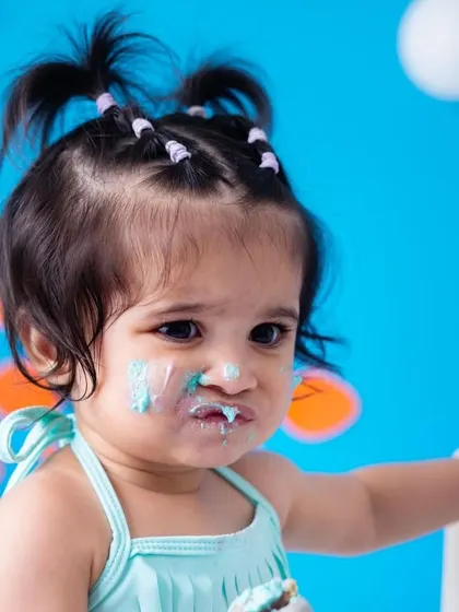 The face of pure, sugary bliss. This little mermaid's messy face and pout are just too cute. These close-up shots are perfect for remembering every adorable detail of their first birthday.