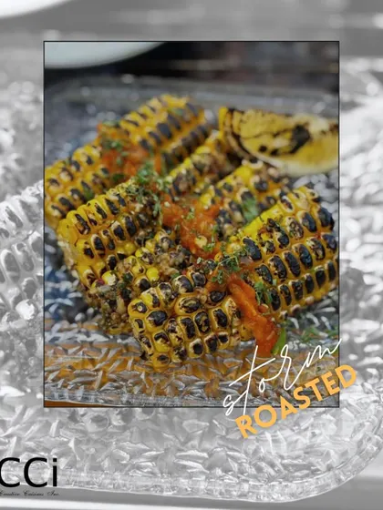 A monsoon favorite, reimagined. Our 'Storm Roasted' corn is grilled to perfection, charred for a smoky flavor, and topped with a fresh, tangy salsa, offering a sophisticated twist on classic roasted corn on the cob.