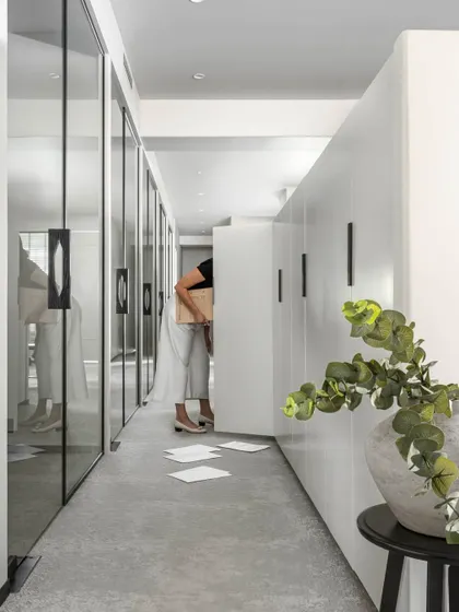 We believe in maximizing space by minimizing clutter. This passageway was transformed with minimalist, full-height storage, redefining functionality without sacrificing flow. The result is a streamlined, organized, and efficient office.