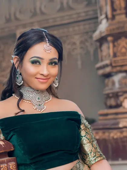 A smiling portrait of the model, showing how the jewellery brightens up her face.