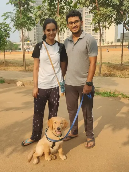 This is Stout with his family during one of our early outdoor training sessions. Starting early with socialization and training in different environments is key to raising a confident dog.