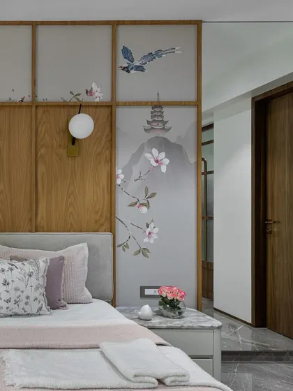 The intricate details of our custom Chinoiserie wallpaper, featuring a flying bird and a distant pagoda, are framed by wood panels. This thoughtful combination creates a layered, narrative-rich backdrop for a truly refined bedroom.