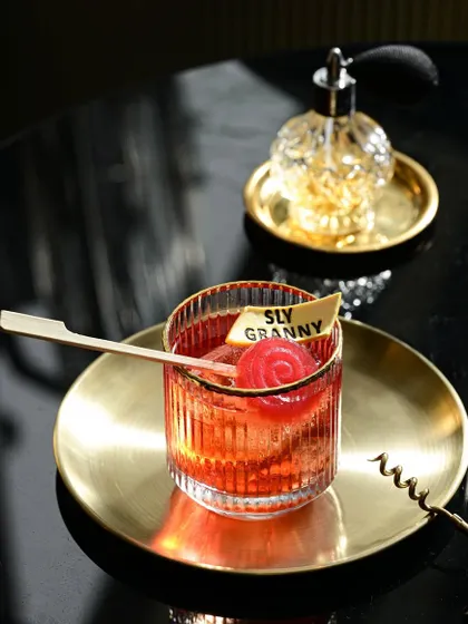 A beautifully captured Castel Del Monte, showcasing its rich color and the signature 'Sly Granny' garnish. It's as bold and unapologetic as I am.