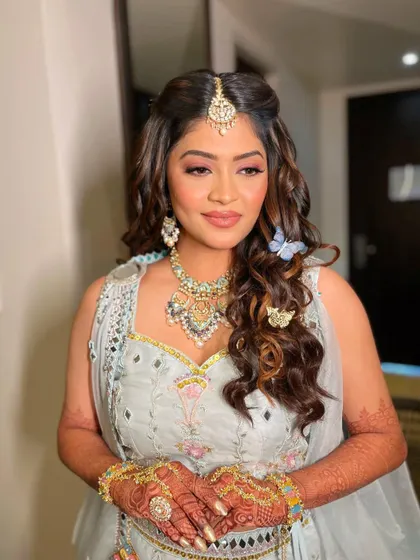 This angle showcases the soft curls and butterfly accessories that make this look so special.