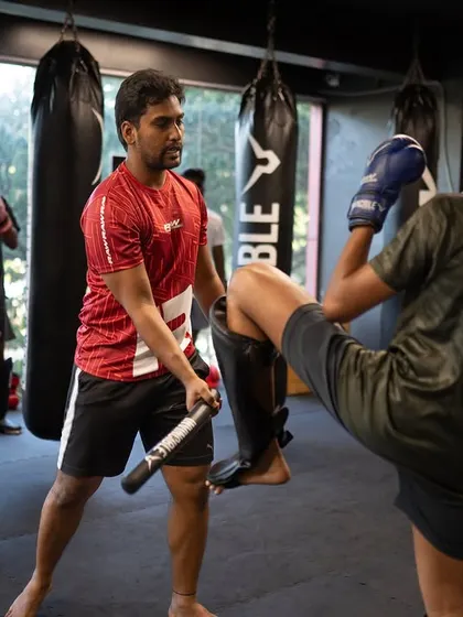 I use training sticks to sharpen a student's defensive reflexes and blocking technique. This drill improves reaction time and ensures they can protect themselves effectively.