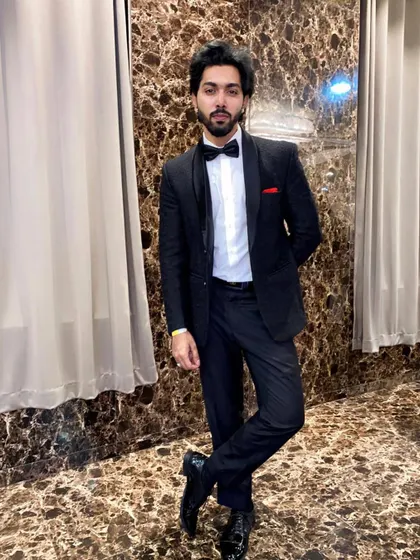 A classic black tuxedo for a timeless look. This outfit is a staple in my rental collection, ensuring any groom looks polished and dapper for his pre-wedding shoot.