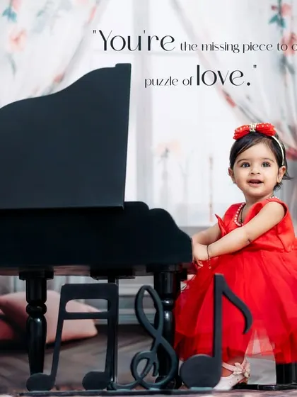 You're the missing piece to our puzzle of love. A sweet girl in a red dress stands by her piano in our romantic, floral studio.