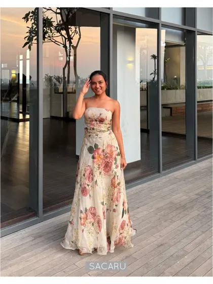The quintessential summer wedding lehenga. This light and breezy strapless ensemble is crafted from silk organza with a beautiful floral print, perfect for outdoor festivities.