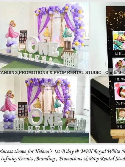 A simple and elegant princess theme for a first birthday, featuring a clean white backdrop draped with curtains and accented by a purple and gold balloon garland. The large "ONE" table and a custom milestone board make the setup both beautiful and personal.