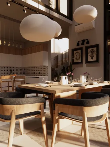 This open-plan dining and kitchen area is bathed in sunlight from double-height windows. I used a neutral color palette with black accents and natural wood tones to create a space that feels both modern and warm.