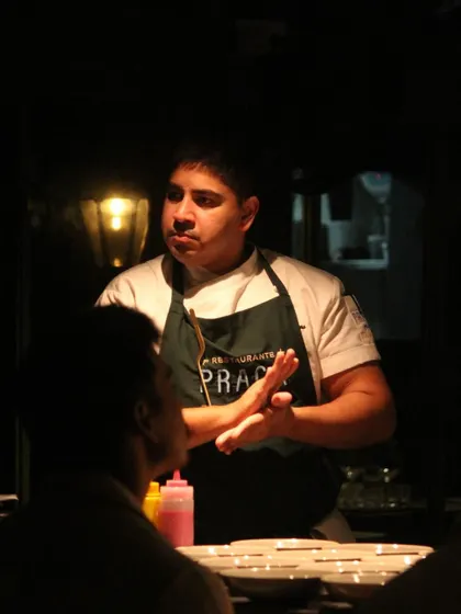 Chef Ralph Prazeres of Praça Prazeres engaging with guests during 'The Wonder Years' dinner, sharing the stories behind their collaborative menu.