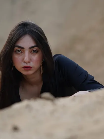 A close-up, intense portrait from the sand shoot. The raw emotion in this unedited photo is what makes it so powerful.