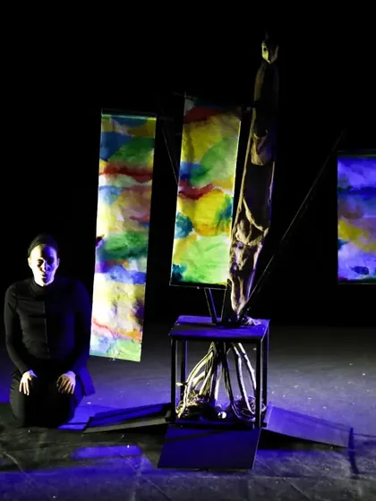 The stage of 'Wings & Roots' is decorated with colourful banners, representing the renewal of life after the great flood in this adaptation of a timeless tale.