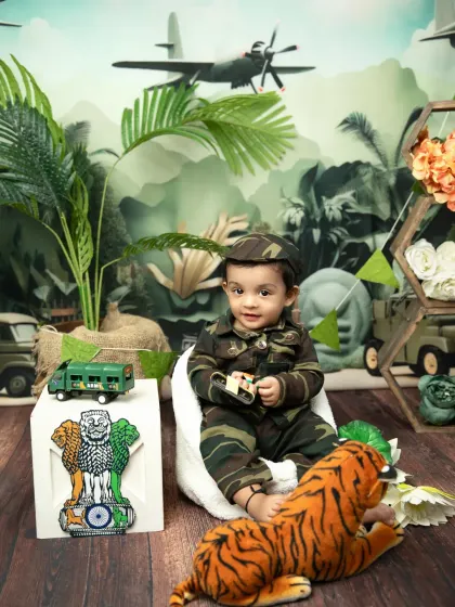 A full view of the Independence Day setup, with a toy army truck, the national emblem, and a jungle backdrop.