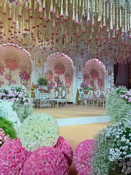 Various angles of the pastel mandap, showcasing the expanse of blooms, the custom seating, the floral aisle, and the intricate details that made this a truly wholesome and majestic celebration.