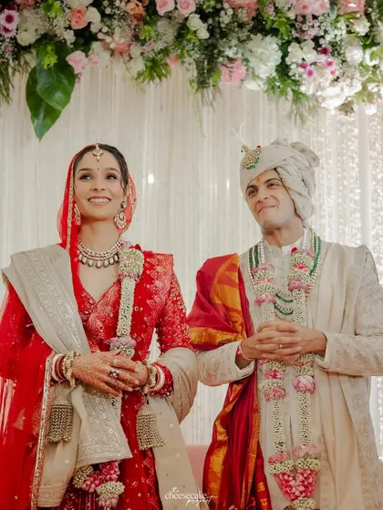 A beautiful portrait of the couple standing together, looking radiant after their wedding ceremony.