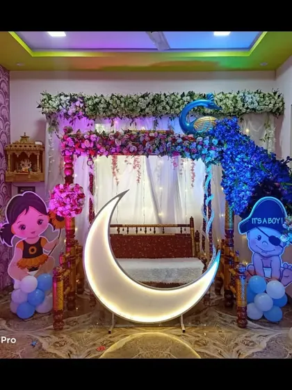 The peacock-themed decor under blue lighting, creating a magical, nighttime feel. The lighting can be adjusted to create various effects.