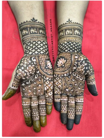 A classic, fully detailed Indian bridal design. Notice the balance between the delicate floral patterns, the bold geometric fillers, and the traditional elephant motifs on the wristband. This is a style that is always in demand.