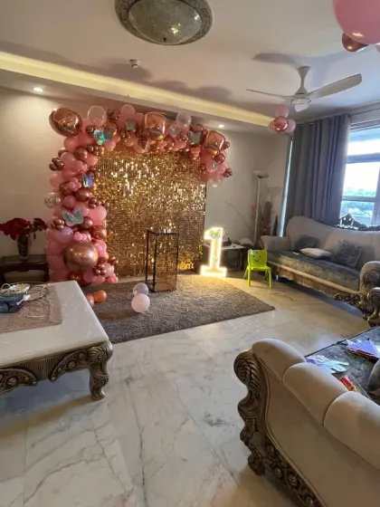 A full room view demonstrating how a sequin wall setup can become the stunning centerpiece of your home party decorations.