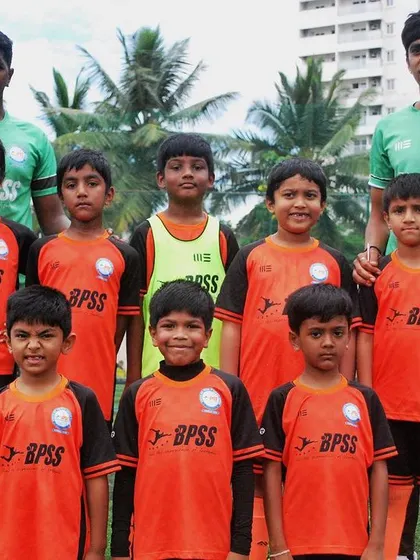 The U-9 team poses with their coaches, ready for their next challenge. I build teams that are disciplined, united, and ready to play.