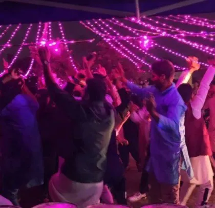 Another angle of the energetic crowd at the corporate Diwali celebration.