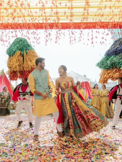 The heart of any celebration is the pure, unscripted joy of the couple. We orchestrate grand entries, like this one with a shower of confetti and performers, to create high-energy moments that become treasured memories.