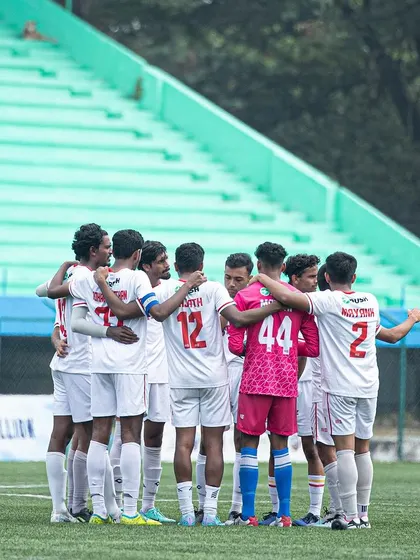 The pre-match huddle. A moment of focus and unity before stepping onto the pitch to battle for three points.