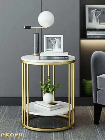 Our 9-stick round coffee table shown in a contemporary living room. The gold frame and white surfaces complement a minimalist aesthetic while providing functional table space.