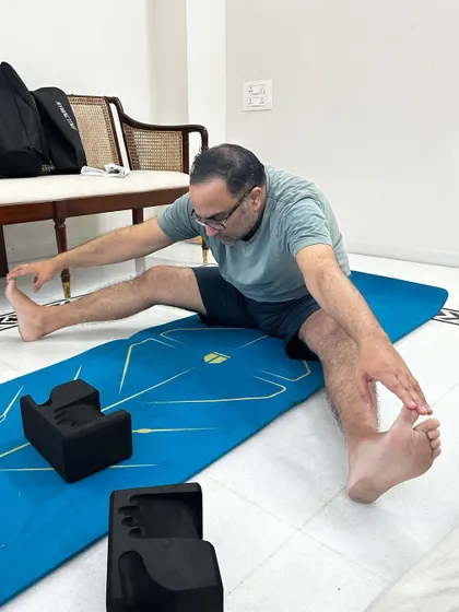 After a year of consistent work, my client is seeing incredible results in managing his Gout. Here he is in a seated wide legged forward fold, a pose that was once inaccessible to him.