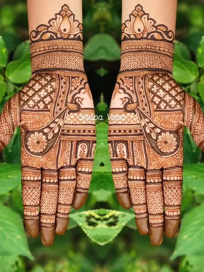 A symmetrical peacock and floral design, another wonderful option for Teej or other festive celebrations.