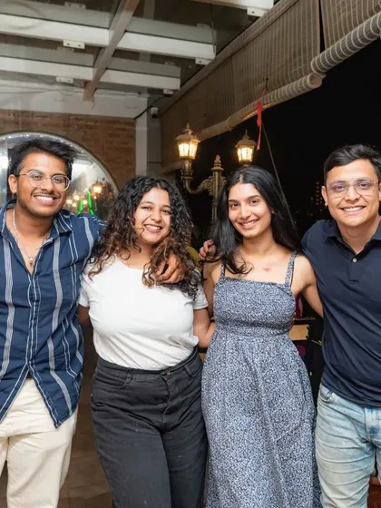 A group of friends enjoying the rooftop area, a perfect spot for a casual get-together.