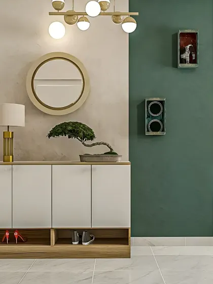 A minimalist entryway console in white and wood, featuring clean lines and handle-free cabinet doors. The open bottom shelf is perfect for frequently used shoes, while the bonsai and circular mirror add a touch of zen-inspired decor.