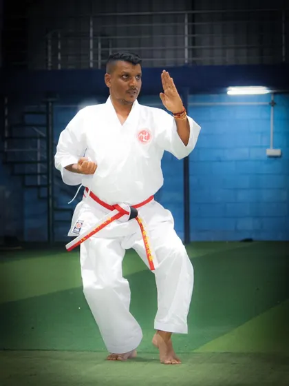 A demonstration of a classic Karate stance and block. Every movement is practiced to perfection, building muscle memory and flawless form.