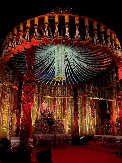 For Ganesh Chaturthi, I designed this magnificent circular mandap. The canopy is made of thousands of hanging jasmine and tuberose strings, creating a divine atmosphere for Bappa.