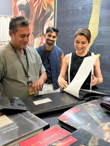Tisca Chopra shares a smile as she delves into our extensive library of wallpaper and fabric samples, discovering the perfect selections for her spaces.