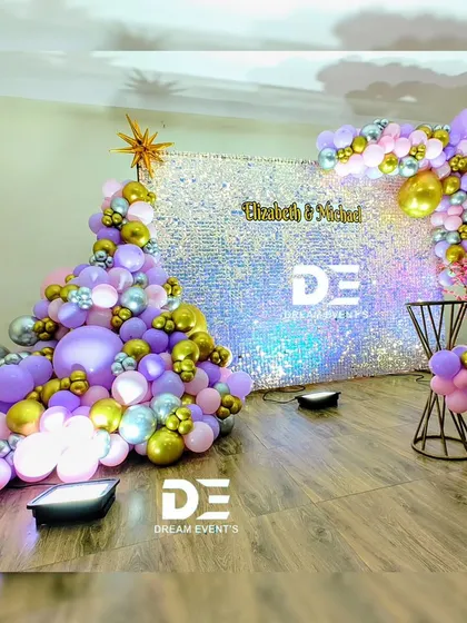 For a touch of modern glamour, I use high-impact backdrops like this iridescent sequin wall. Paired with a sophisticated balloon arrangement in purple, silver, and gold, it creates a stunning photo opportunity for any birthday or private party.