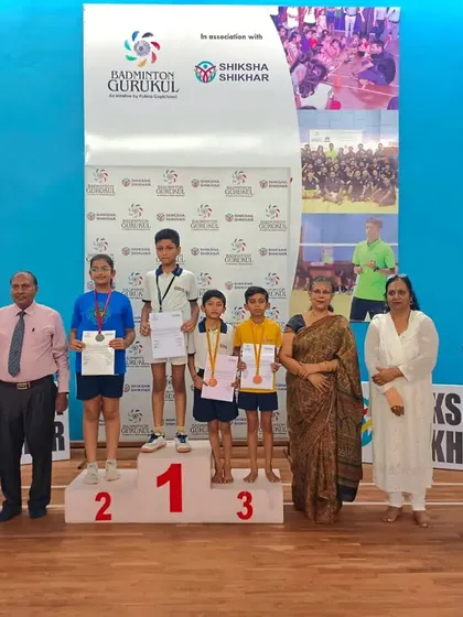 Photos from our successful summer camp and tournament at Shiksha Shikhar, showing students on the podium and in groups.